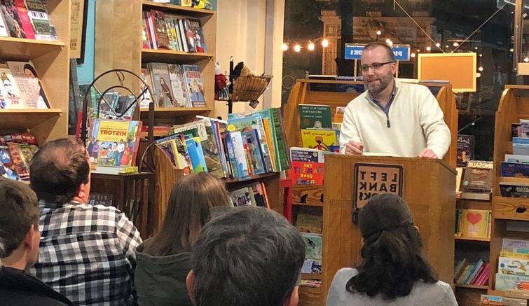 Dr. 本•库珀, Assistant Professor of English, speaks about his book, 《澳门威尼斯人平台官网》, before an engaged crowd at Left Bank Books.